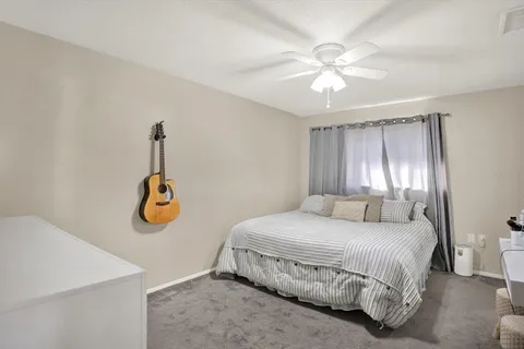 a bedroom with a bed and chandelier