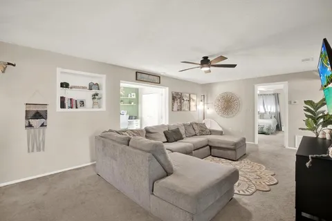 a living room with furniture and a window