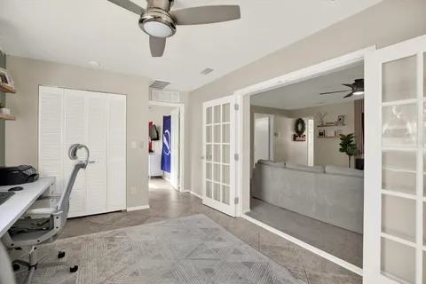 a view of a livingroom with a furniture and ceiling fan