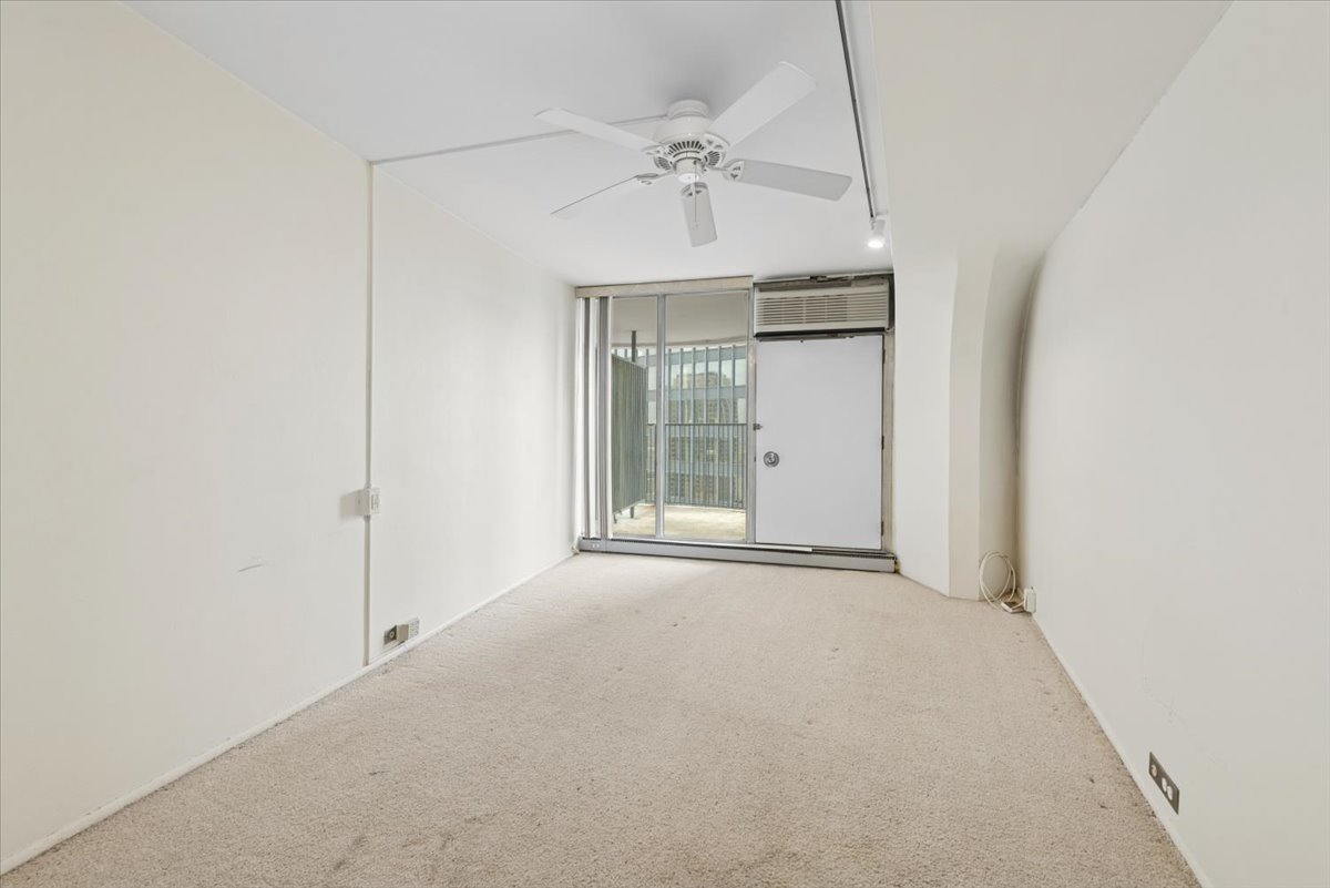 300 North State Street, Unit 4831 Chicago, IL 60654 - Photo 11 of 11 a view of a room with a ceiling fan and entryway