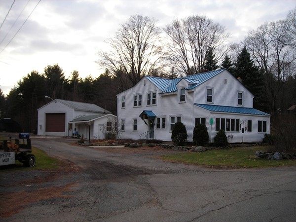 56 Birch Meadow Road Merrimac, MA 01860 - Photo 1 of 7 a front view of a house with a garden