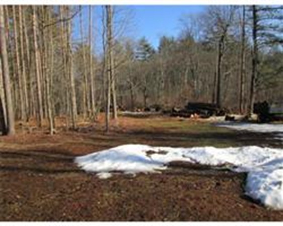 56 Birch Meadow Road Merrimac, MA 01860 - Photo 7 of 7 a view of a lake with a bench