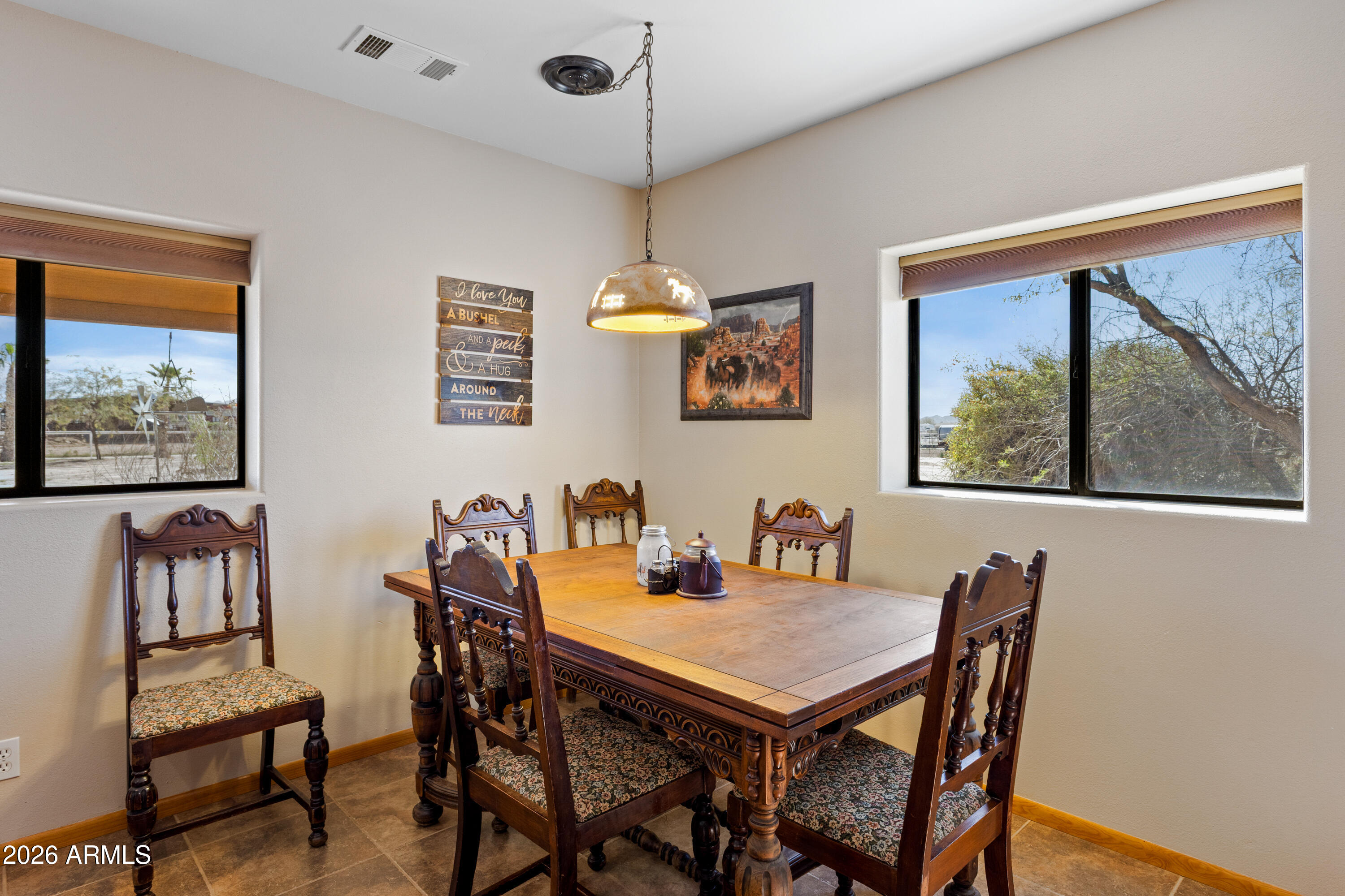20526 West Carver Road Buckeye, AZ 85326 - Photo 14 of 43 a view of a dining room with furniture window and outside view