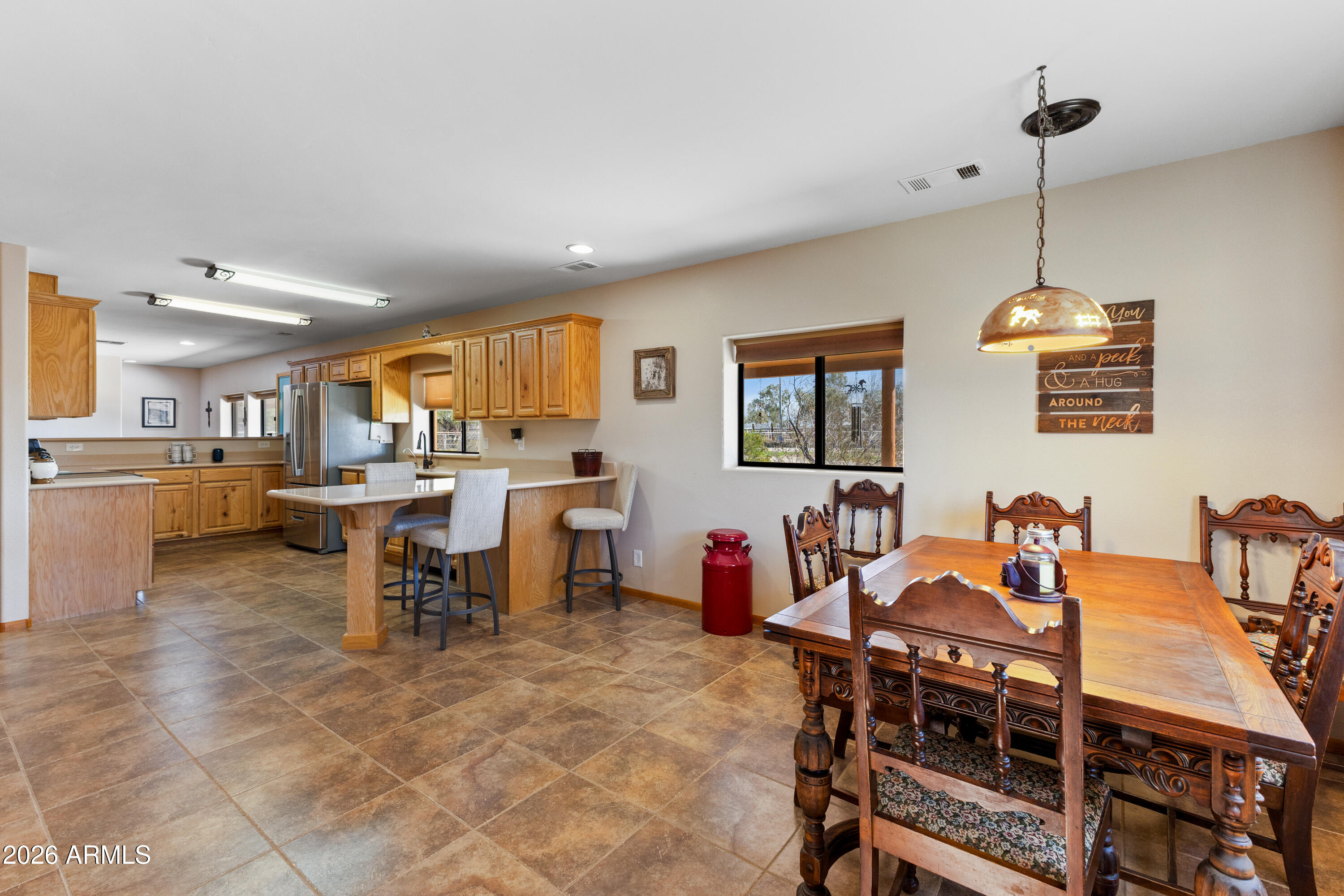 20526 West Carver Road Buckeye, AZ 85326 - Photo 15 of 43 a view of a dining room with furniture
