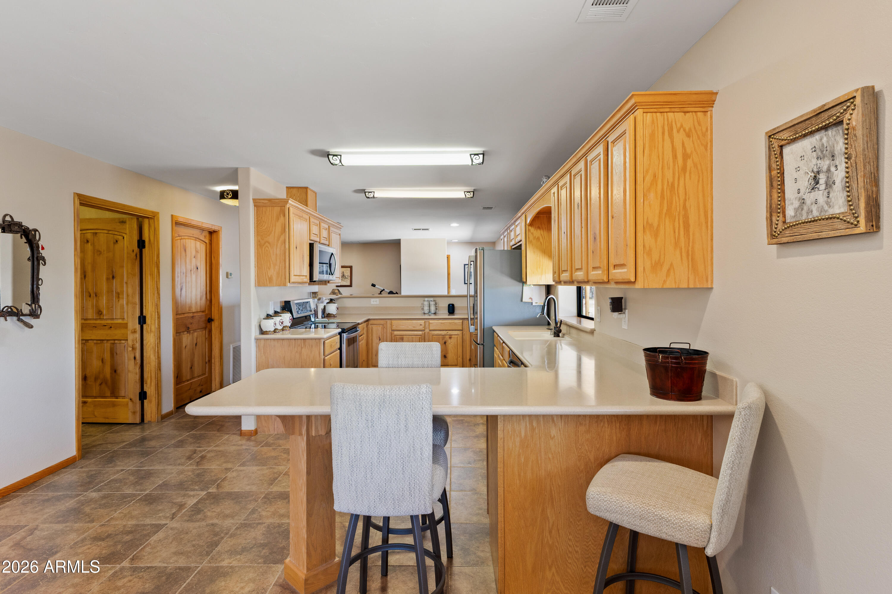 20526 West Carver Road Buckeye, AZ 85326 - Photo 17 of 43 a view of a dining room with furniture and a window