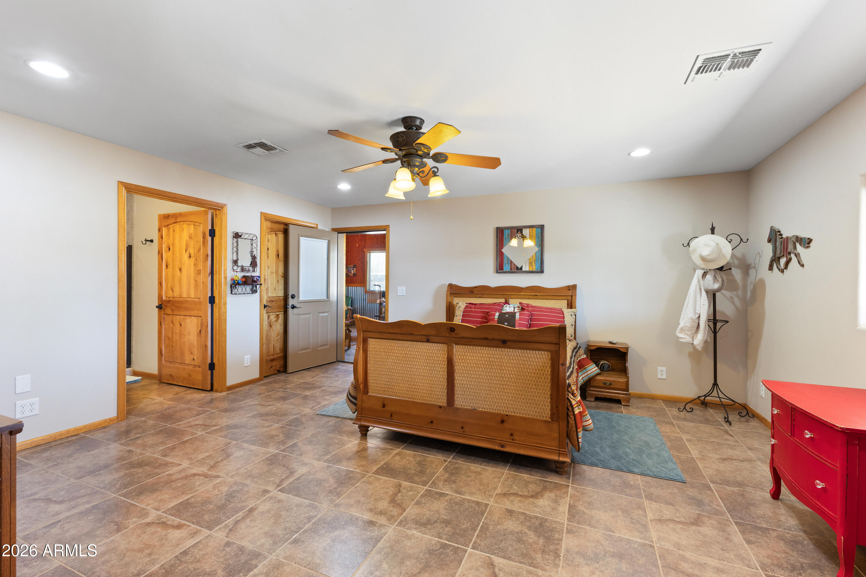 20526 West Carver Road Buckeye, AZ 85326 - Photo 20 of 43 a living room with furniture and a chandelier