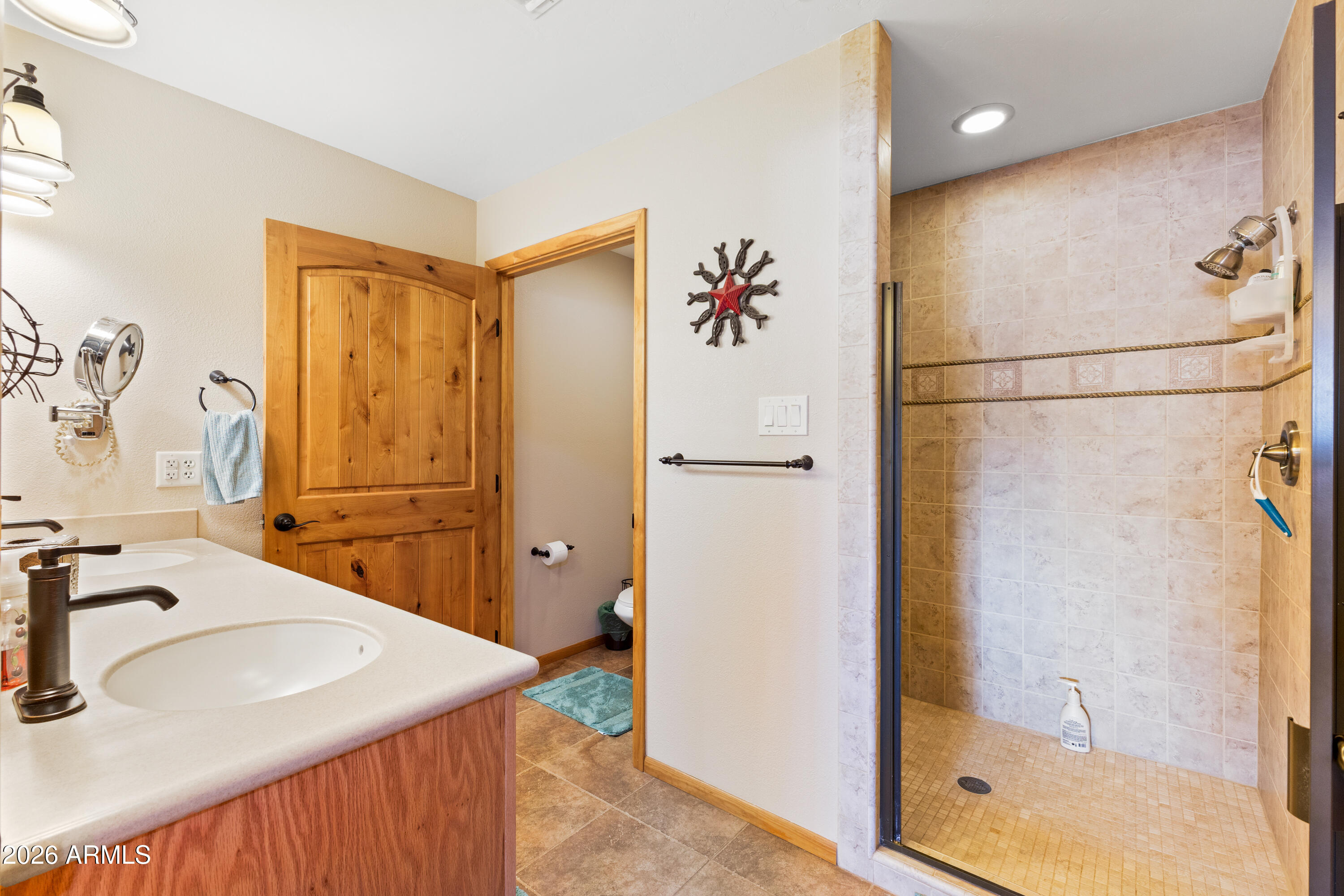 20526 West Carver Road Buckeye, AZ 85326 - Photo 23 of 43 a bathroom with a sink and a mirror