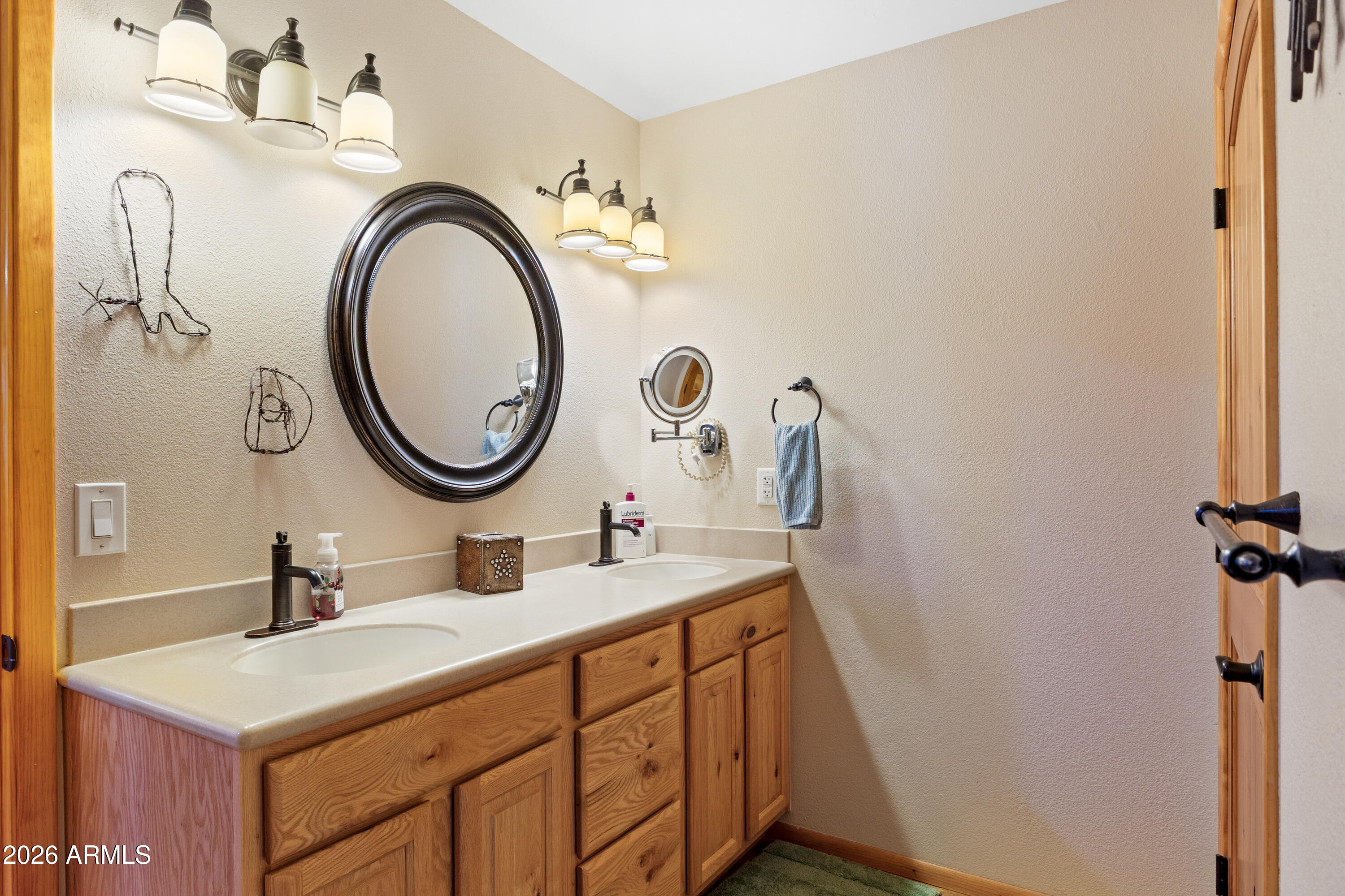 20526 West Carver Road Buckeye, AZ 85326 - Photo 24 of 43 a bathroom with a sink vanity and a mirror