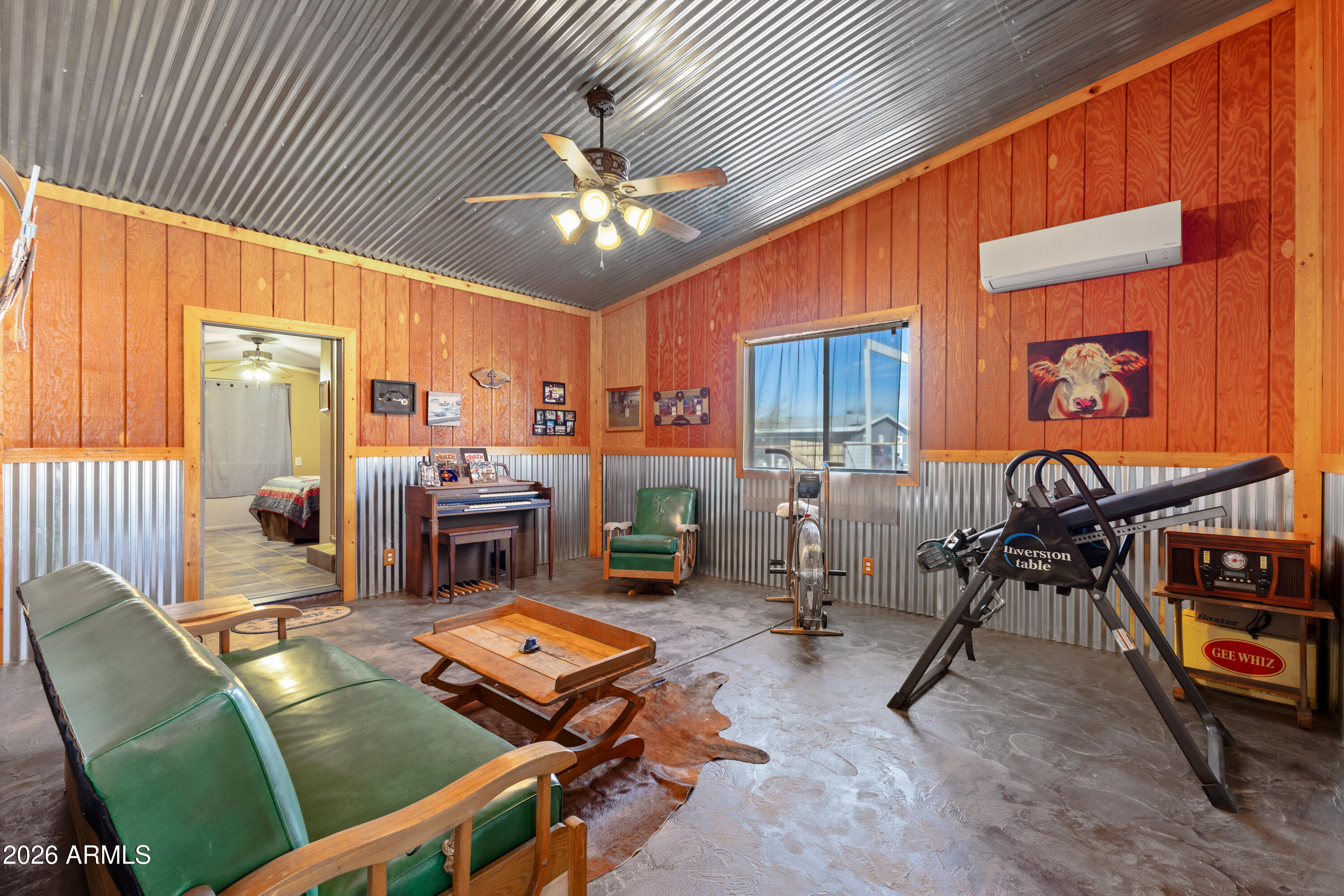 20526 West Carver Road Buckeye, AZ 85326 - Photo 25 of 43 a living room with furniture a flat screen tv and kitchen view
