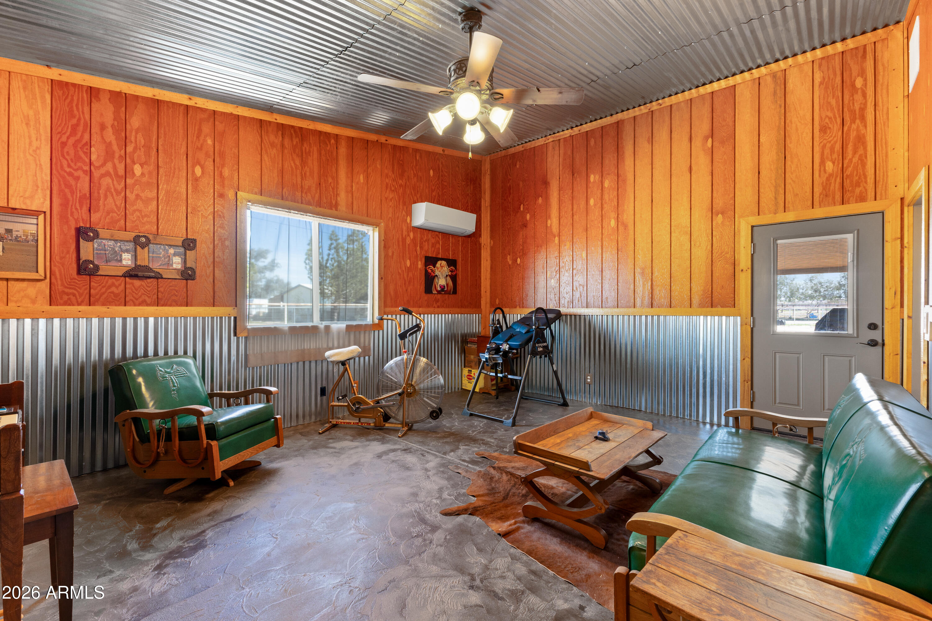 20526 West Carver Road Buckeye, AZ 85326 - Photo 26 of 43 a bedroom with furniture and a chandelier
