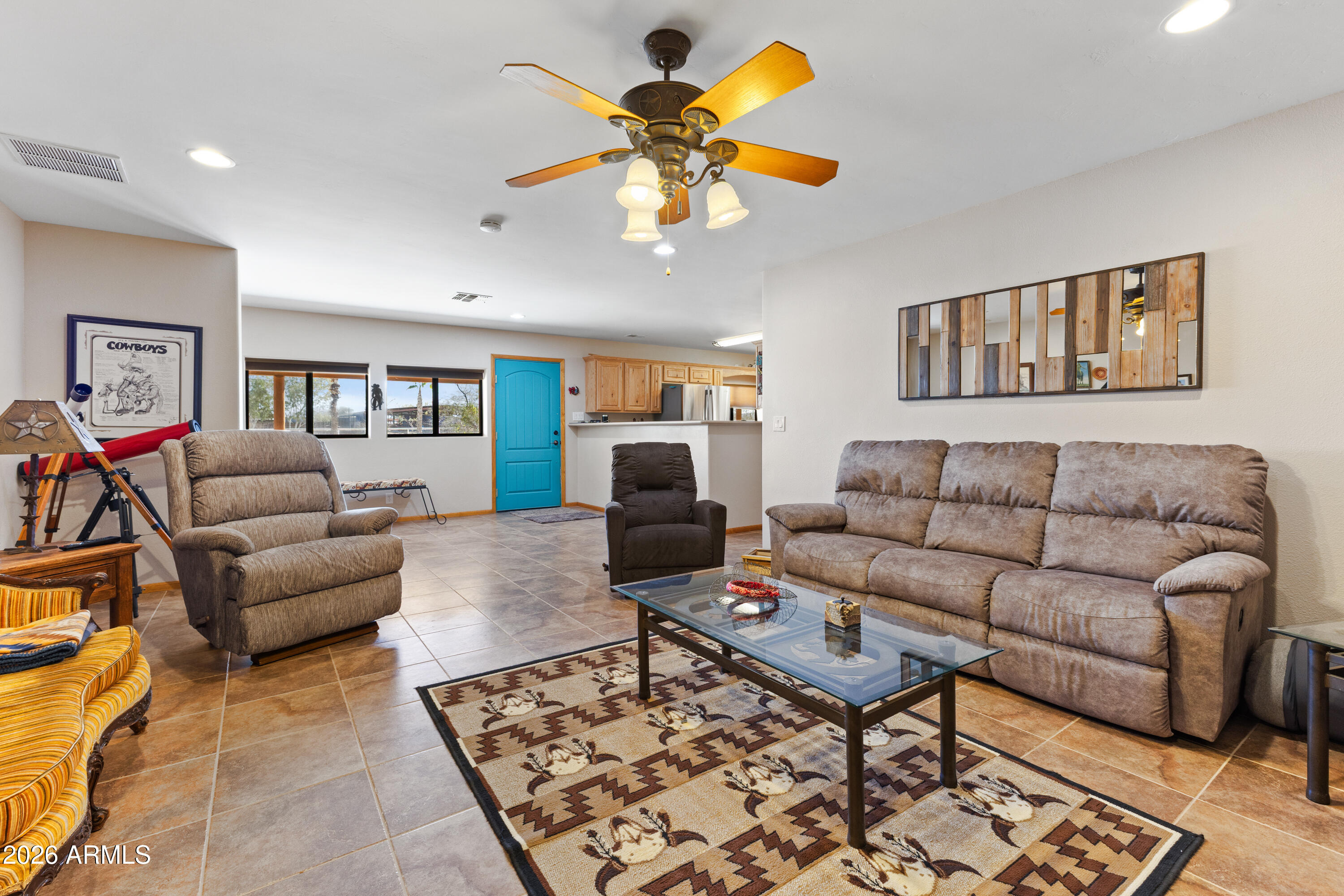 20526 West Carver Road Buckeye, AZ 85326 - Photo 6 of 43 a living room with furniture and a rug