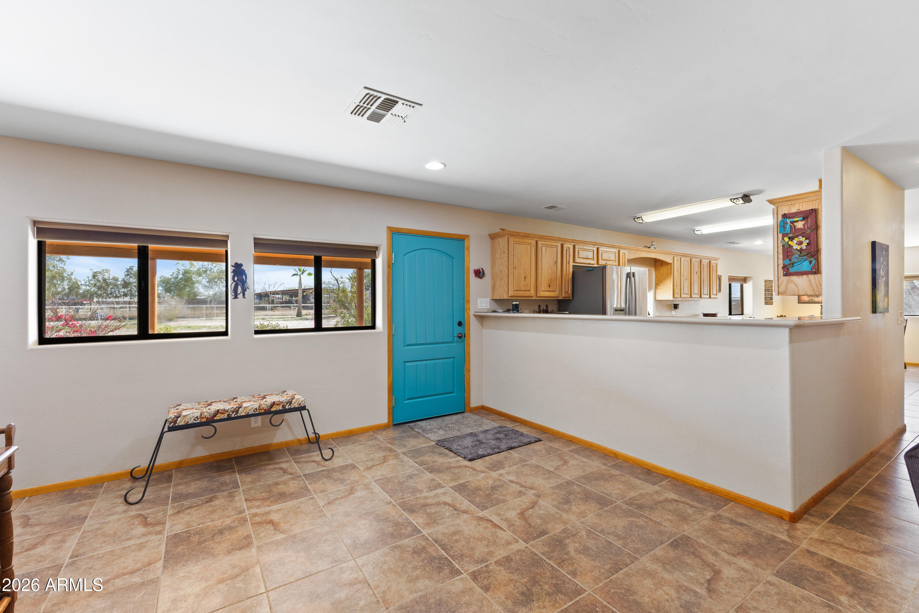 20526 West Carver Road Buckeye, AZ 85326 - Photo 7 of 43 a view of a kitchen with furniture and a window
