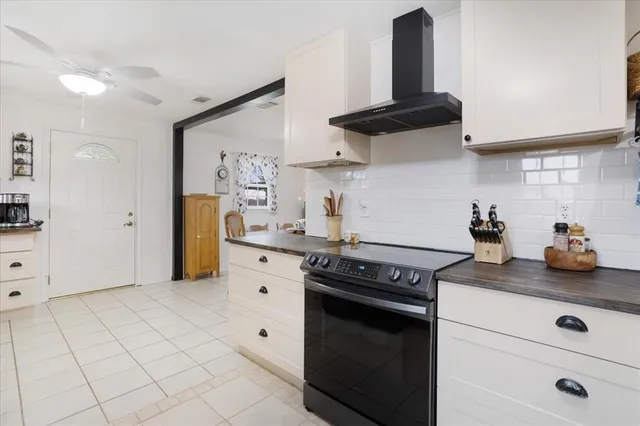 a kitchen with cabinets and appliances