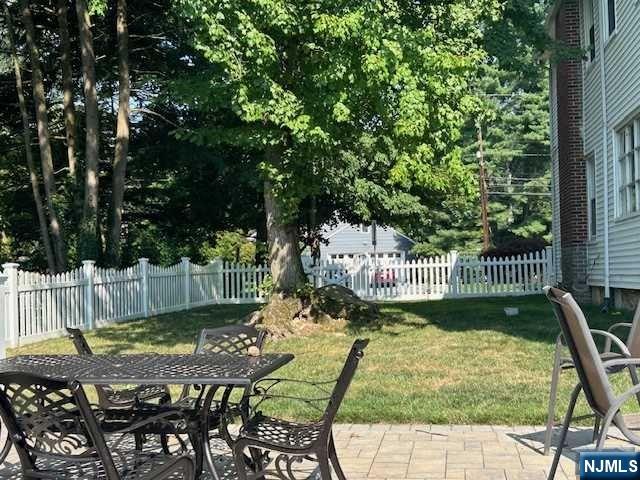 295 Lincoln Avenue Ridgewood, NJ 07450 - Photo 16 of 17 a view of a swimming pool with a patio and a yard