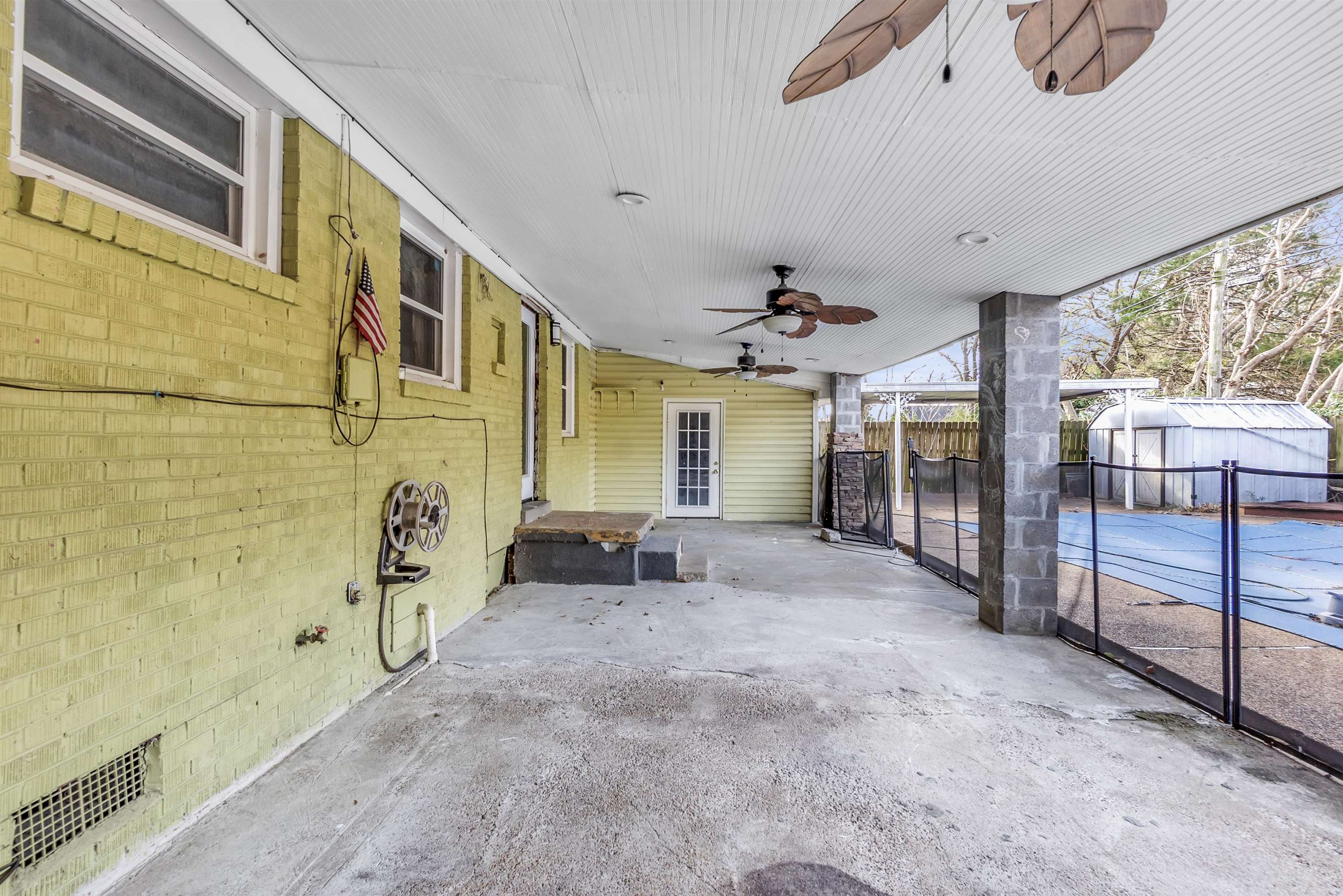 1903 Capri Road Memphis, TN 38117 - Photo 15 of 17 Covered Patio with additional attached storage room.