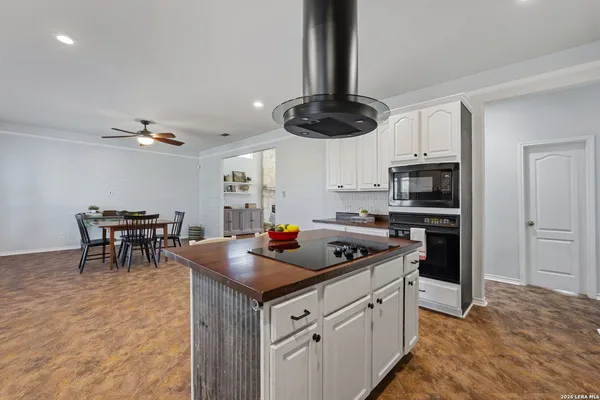 a kitchen with stainless steel appliances granite countertop a stove and a sink