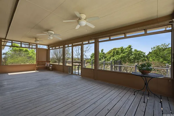 a view of a room with wooden floor and outdoor space