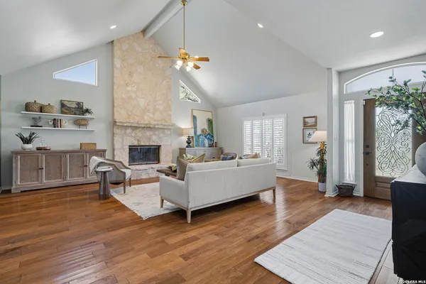 a living room with furniture and a fireplace