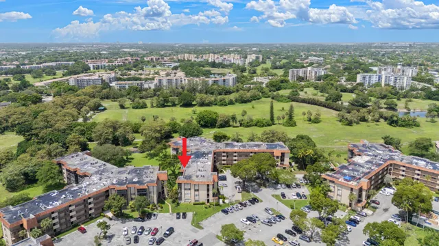 an aerial view of a houses with a yard