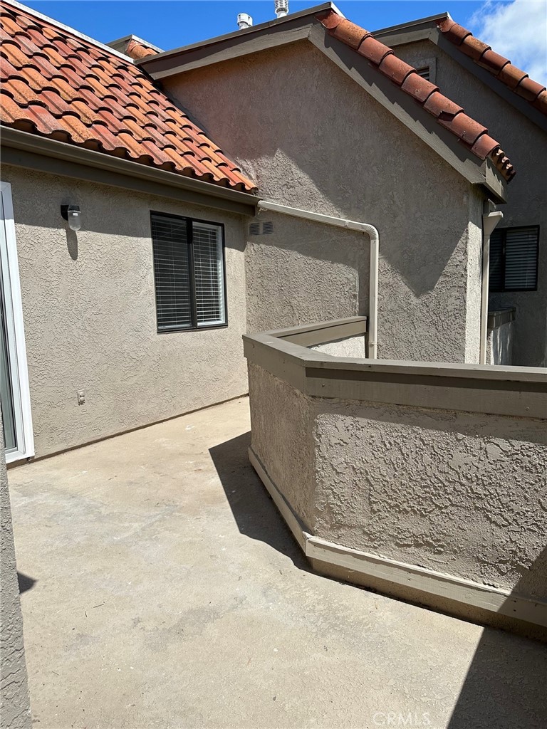 28142 Mariposa, Unit 154 Laguna Niguel, CA 92677 - Photo 22 of 35 a side view of a house with a door