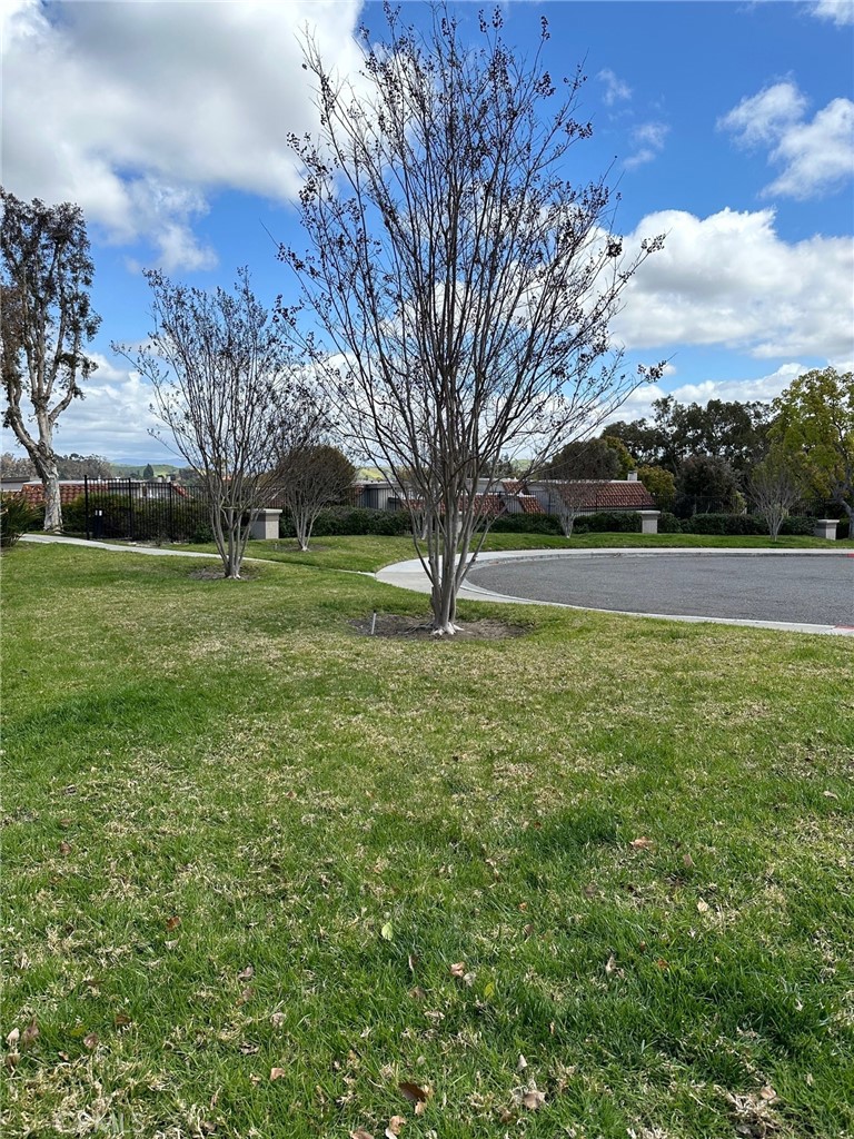 28142 Mariposa, Unit 154 Laguna Niguel, CA 92677 - Photo 27 of 35 a view of outdoor space with green field and trees