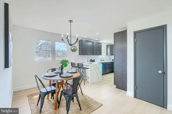 a kitchen with stainless steel appliances a sink stove and refrigerator