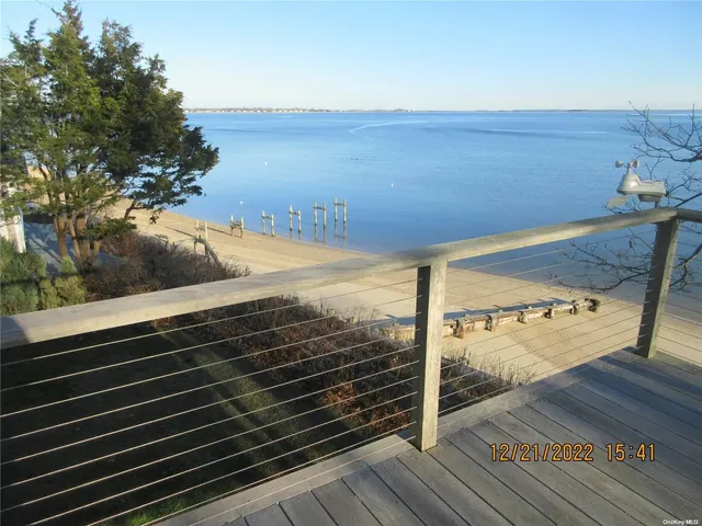 a view of a balcony with an ocean view