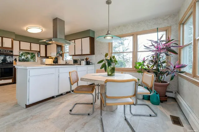 a dining room with furniture window and outdoor space