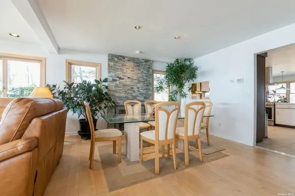 a view of a dining room with furniture and window