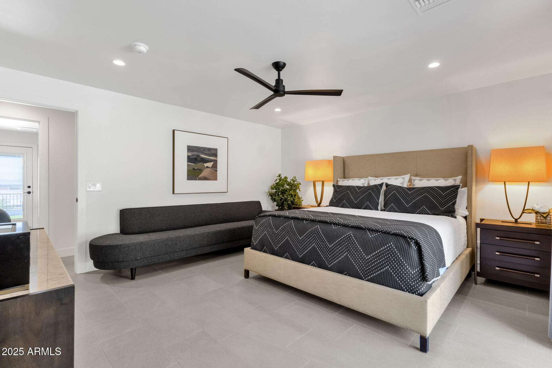 7112 North 23rd Way Phoenix, AZ 85020 - Photo 22 of 50 a spacious bedroom with a bed a couch and a lamp