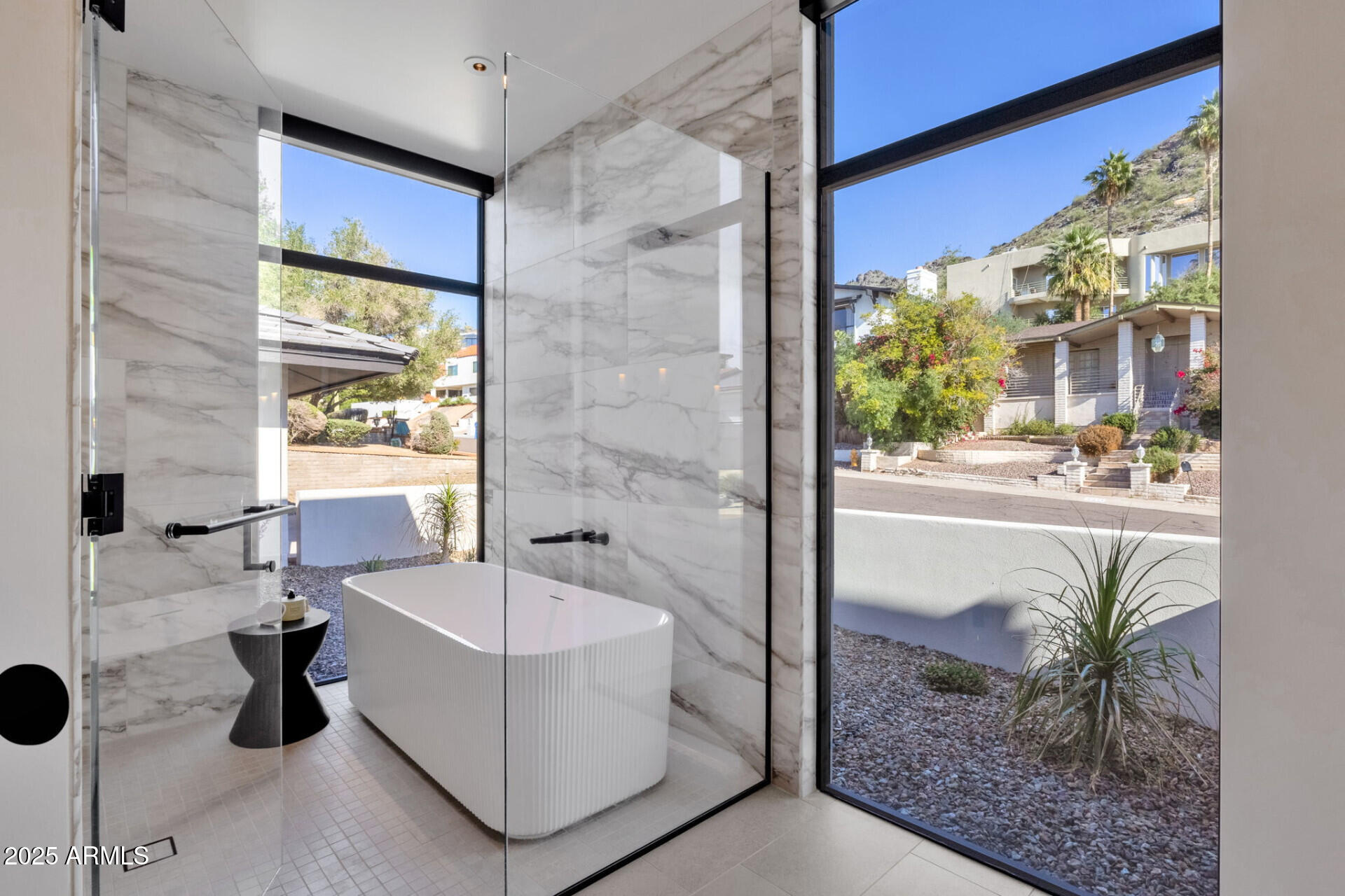 7112 North 23rd Way Phoenix, AZ 85020 - Photo 25 of 50 a bathroom with a tub sink and mirror