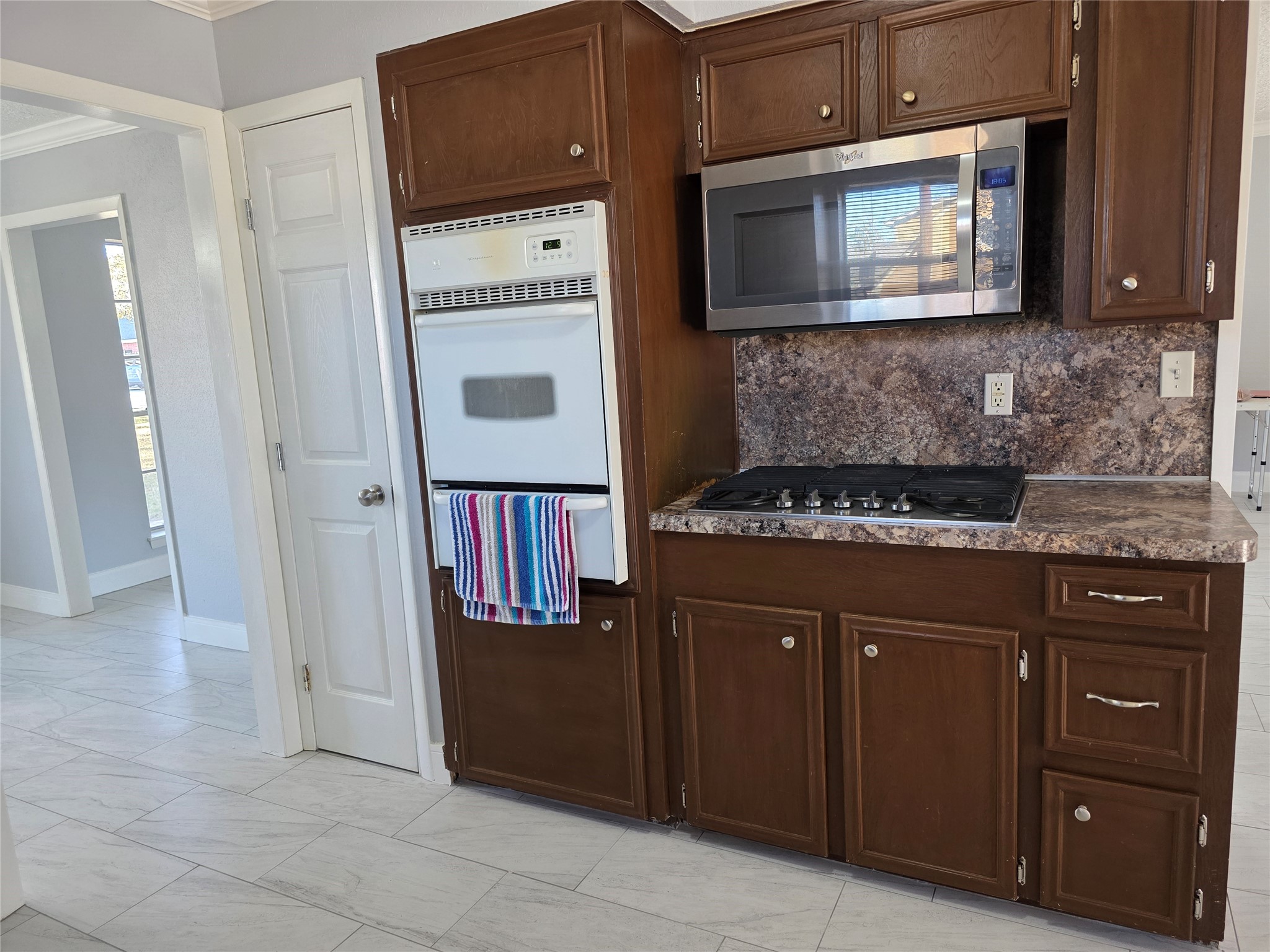 1819 Papoose Trail Crosby, TX 77532 - Photo 13 of 26 a kitchen with granite countertop cabinets and black appliances