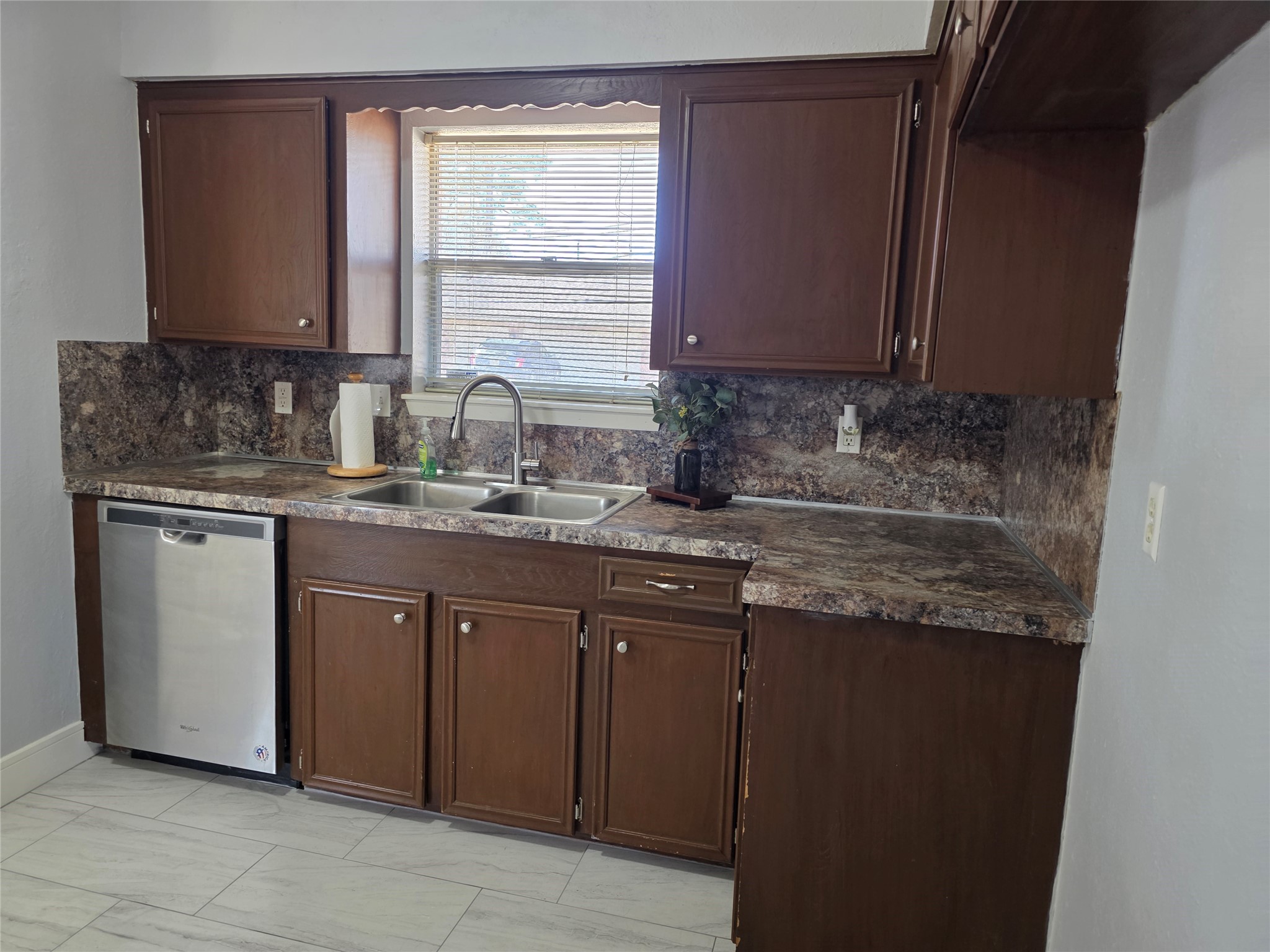 1819 Papoose Trail Crosby, TX 77532 - Photo 14 of 26 a kitchen with stainless steel appliances granite countertop a sink stove and cabinets