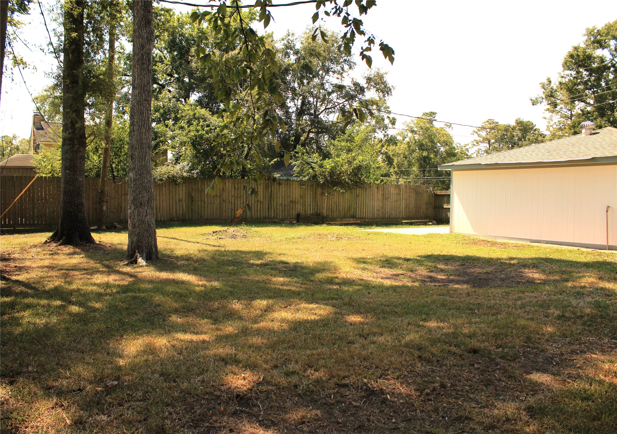 1819 Papoose Trail Crosby, TX 77532 - Photo 8 of 26 a view of yard with swimming pool and trees