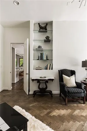 a view of a living room and hardwood floor