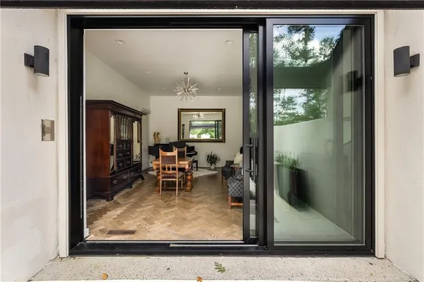 a bedroom with a bed couch and a window