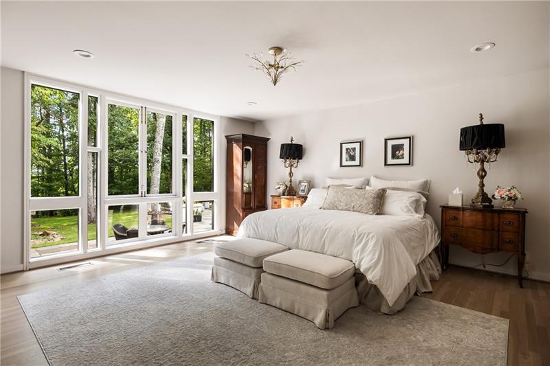 9650 Coleman Road Roswell, GA 30075 - Photo 35 of 97 a spacious bedroom with a bed and a large window