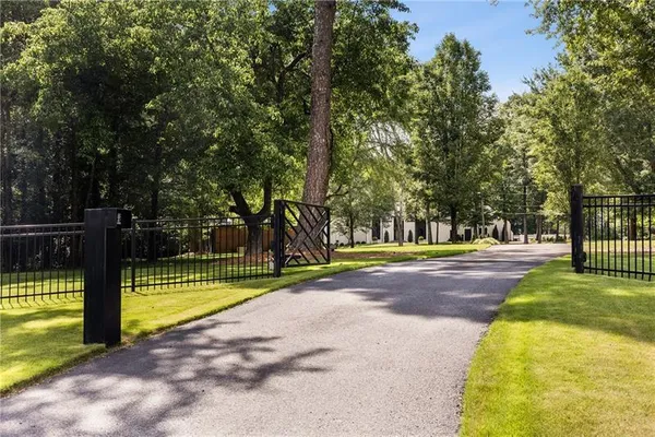 a view of backyard with seating area and green space