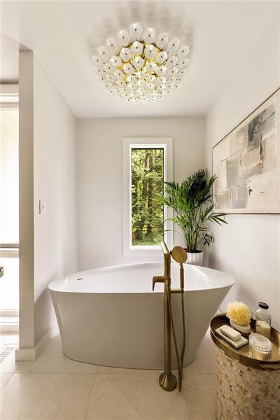 9650 Coleman Road Roswell, GA 30075 - Photo 42 of 97 a white bath tub sitting in a bathroom next to a window