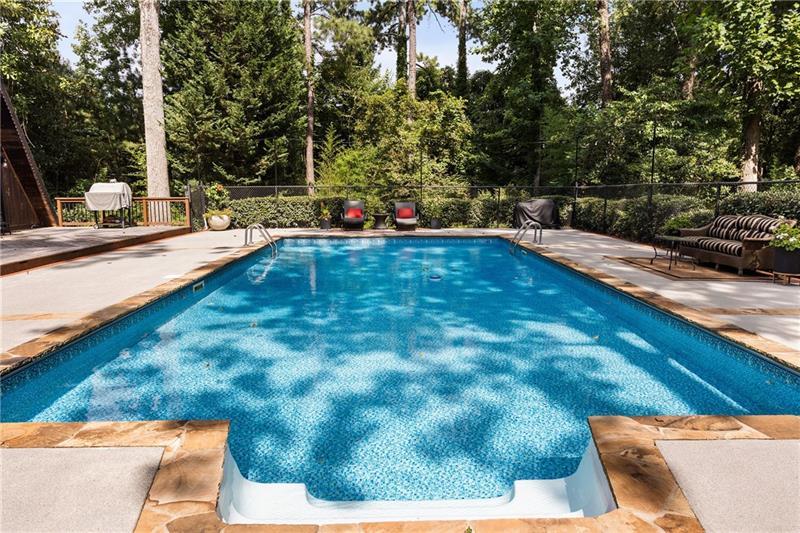 9650 Coleman Road Roswell, GA 30075 - Photo 82 of 97 a view of a swimming pool with an outdoor seating