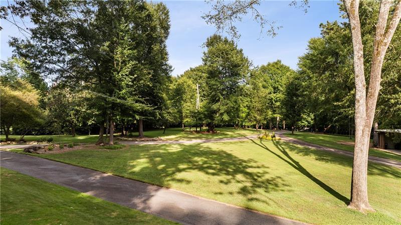 9650 Coleman Road Roswell, GA 30075 - Photo 93 of 97 a view of a swimming pool with yard