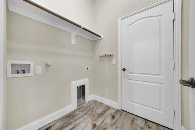 a view of a kitchen with a sink and a window