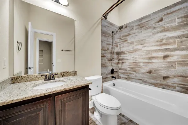a view of a kitchen with wooden floor and a kitchen