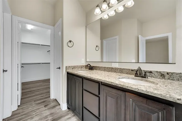 wooden floor in a hall with an empty room
