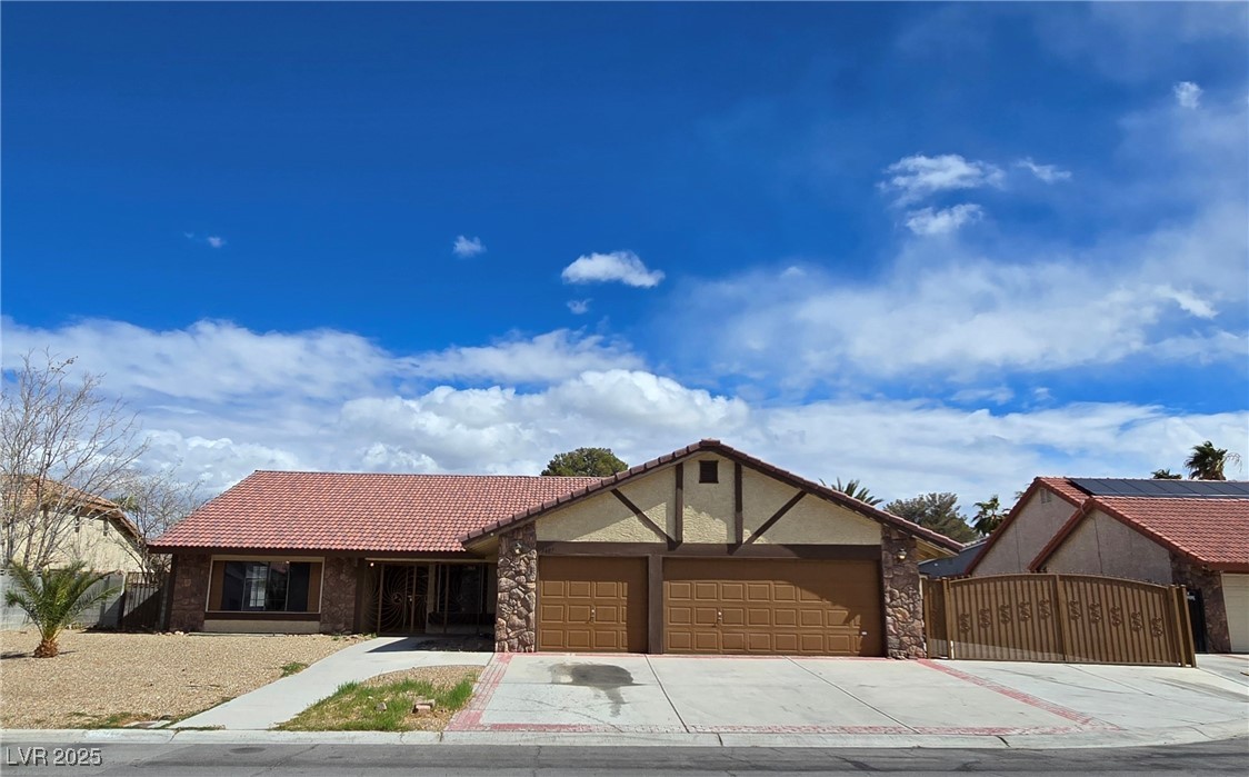 3407 Bristlecone Street Las Vegas, NV 89146 - Photo 1 of 15 Ranch-style home with a tiled roof, concrete drive