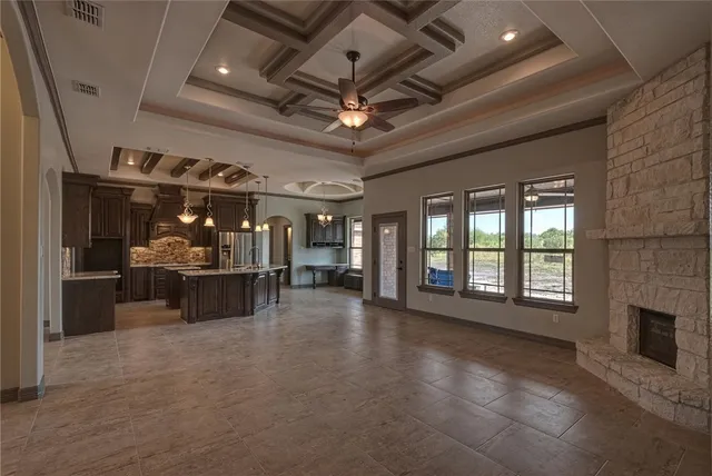wooden floor in an empty room with a fireplace