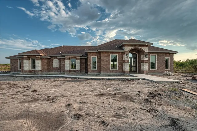 a view of a hallway with a chandelier