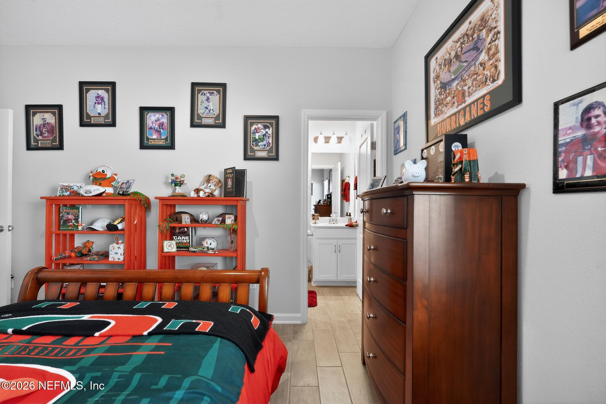 75505 Banyan Way Yulee, FL 32097 - Photo 16 of 30 a bedroom with furniture and a book shelf