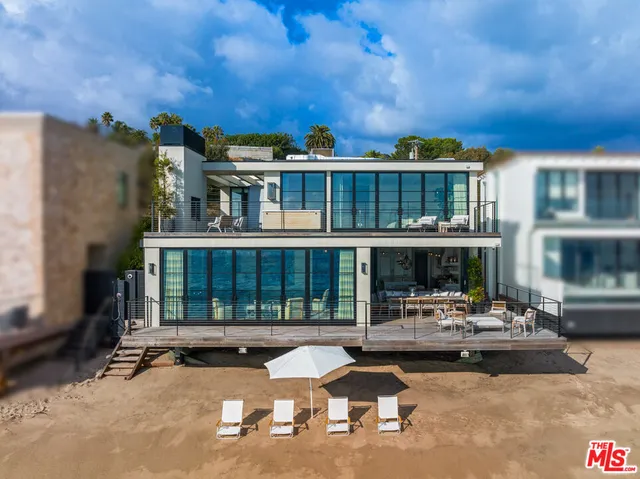 a view of a patio with swimming pool table and chairs