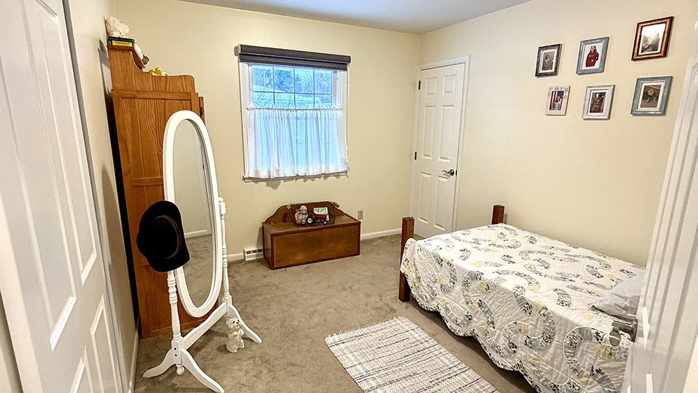 516 Christopher Street Morrison, IL 61270 - Photo 14 of 31 a bedroom with a bed and a window